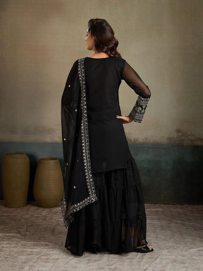 Black embroidered georgette kurta sharara set - smiling full front view