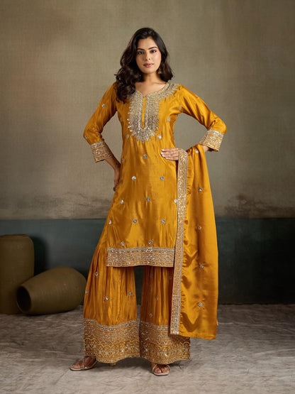 Mustard yellow zari embroidered silk kurta palazzo set - front view hands on hips