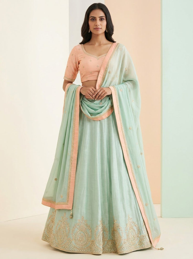 Embroidered Lehenga – Mint Green with Blush Peach Choli & Gold Thread Paisley Work