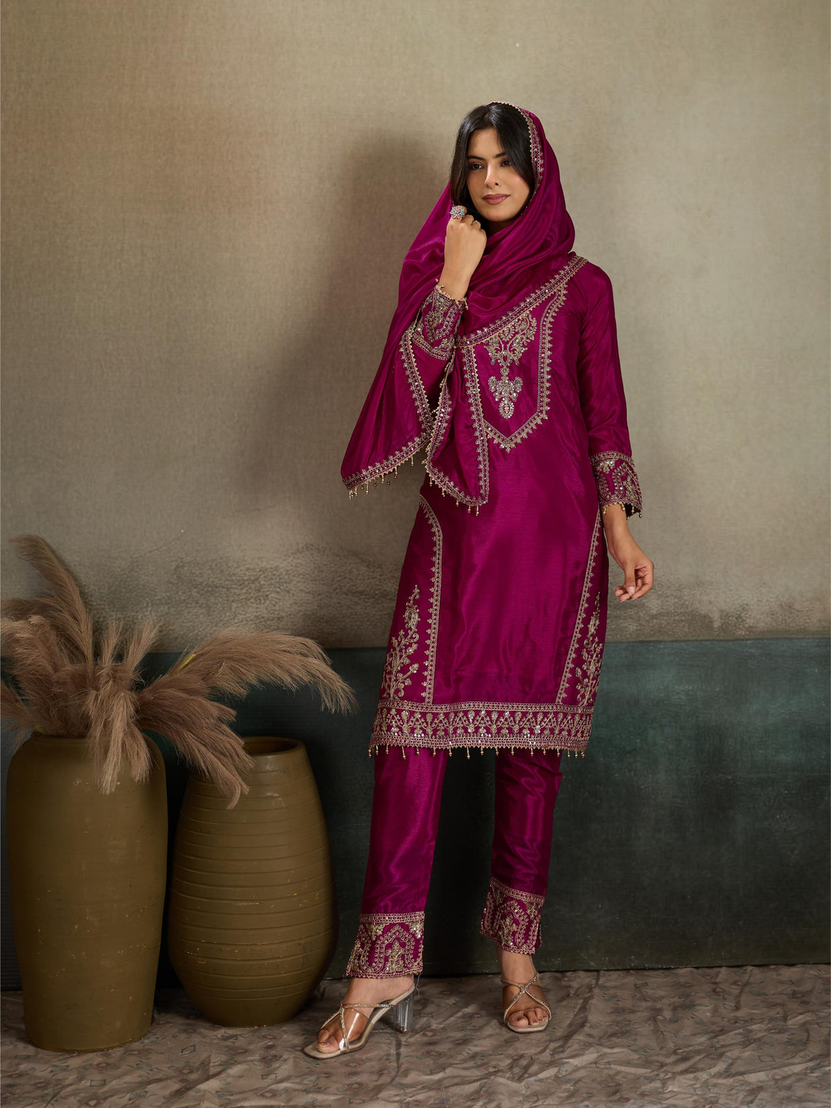 Magenta rani pink gold zari embroidered silk kurta pant set - three-quarter front view dupatta as hijab showing full silhouette