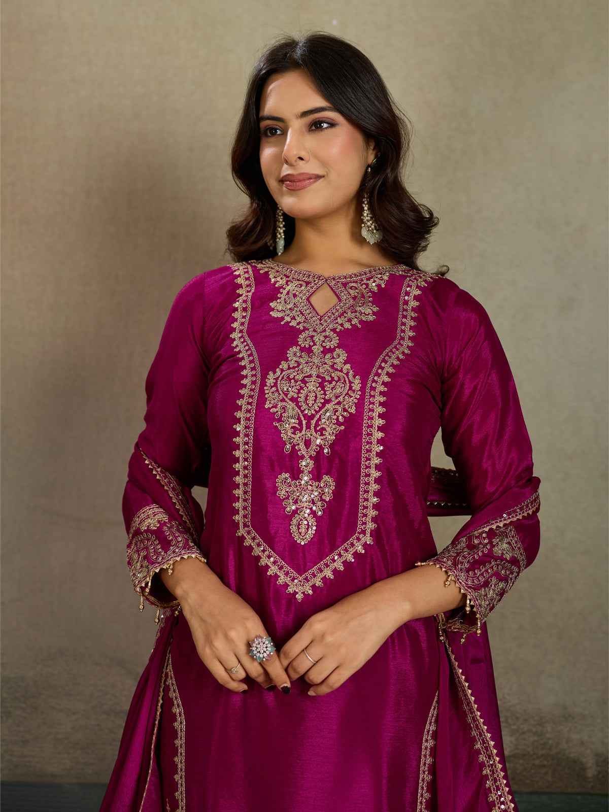 Magenta rani pink gold zari embroidered silk kurta pant set - close up neckline V-panel medallion zari embroidery detail