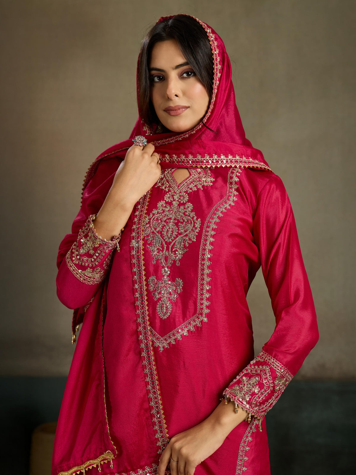 Crimson red gold zari embroidered silk kurta pant set - close up neckline V-panel keyhole medallion zari embroidery detail with hijab drape